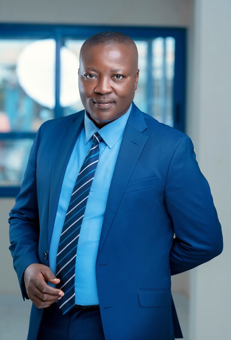 a man in a blue shirt and tie